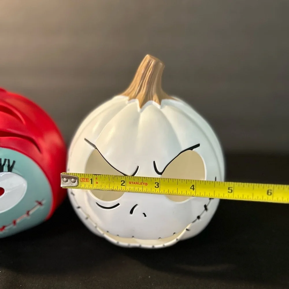 Disneys  light up “night before christmas”  jack/Sally pumpkin heads